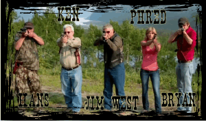 Photo of Hans, Ken Feinman, Jim West, Phred, and Bryan pointing their guns